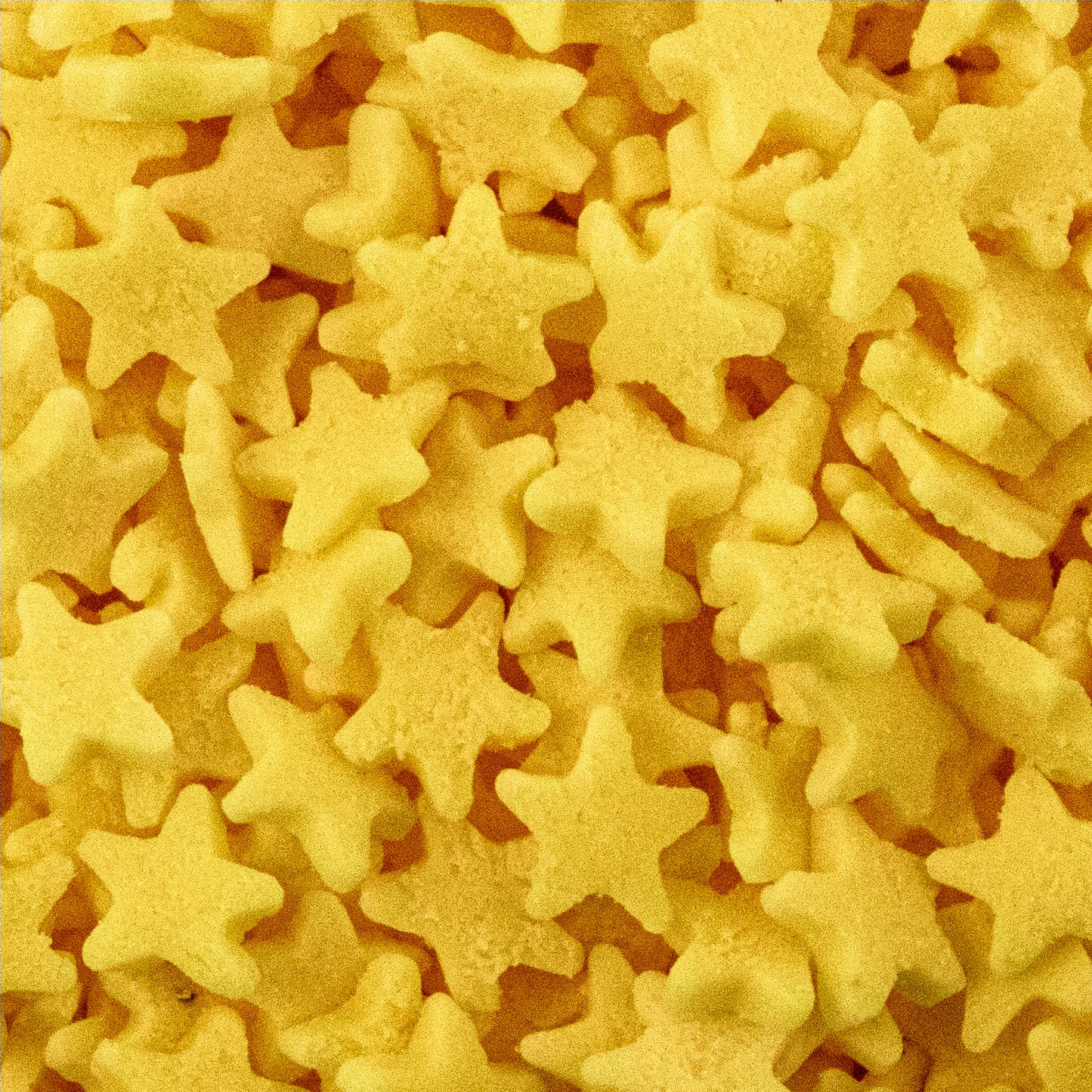 A close-up view of small star-shaped sprinkles.
