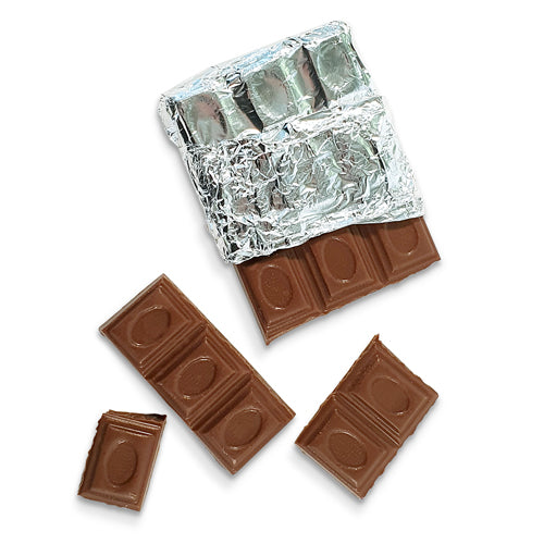 half foil wrapped milk chocolate bar broken into chunks